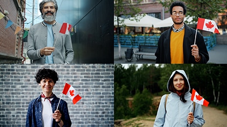 People waving Canadian flags