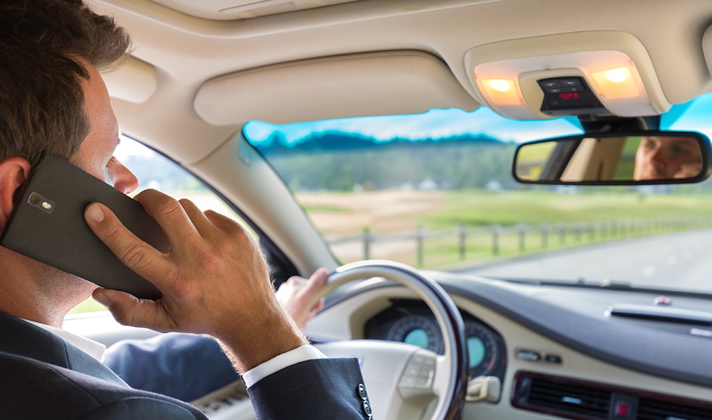 Man talking on the phone while driving