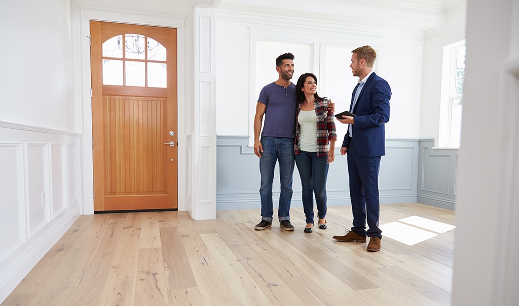 Couple viewing home with an agent