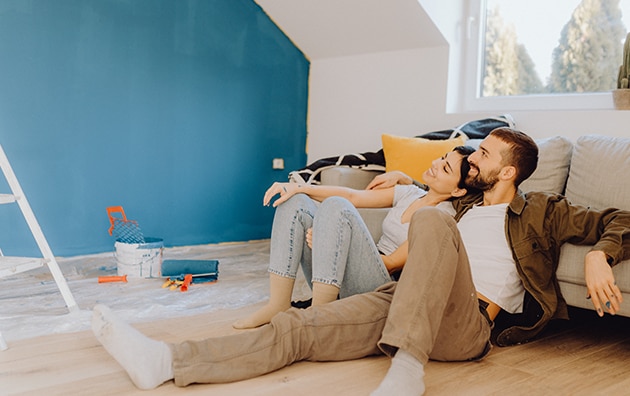 Renters painting a room in an apartment