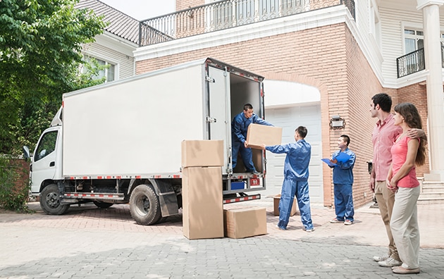 Moving truck unloading boxes