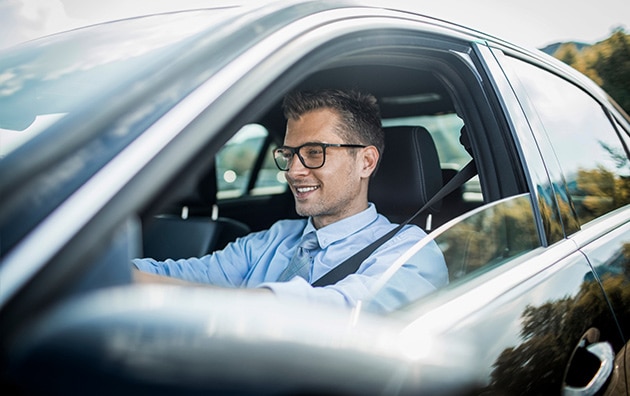 Image of man driving a car