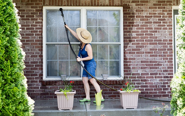 Person watering plants